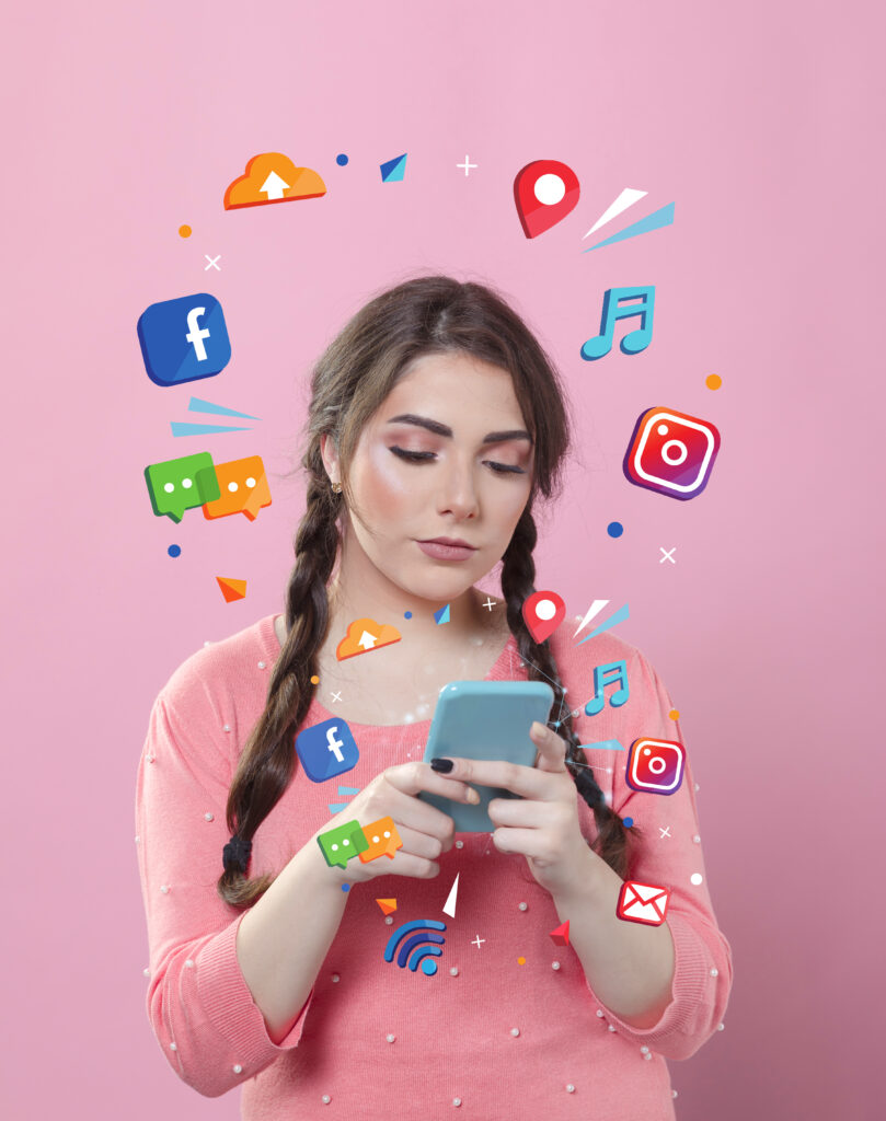 medium-shot-woman-holding-smartphone-2-809x1024 Social Media Marketing Trends to Watch This Year